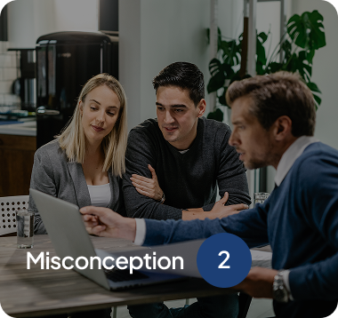 Three people, two men and a woman, looking at a laptop screen during a meeting in an office setting with text 'Misconception 2'.
