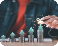 Hand holding a glowing percentage symbol above increasing stacks of coins with upward arrows symbolizing cash flow growth.