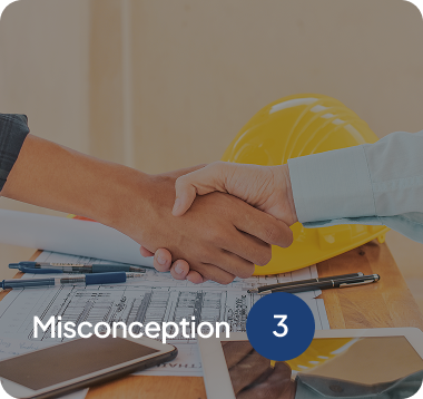 Two people shaking hands over architectural blueprints and construction tools with a yellow hard hat in the background.