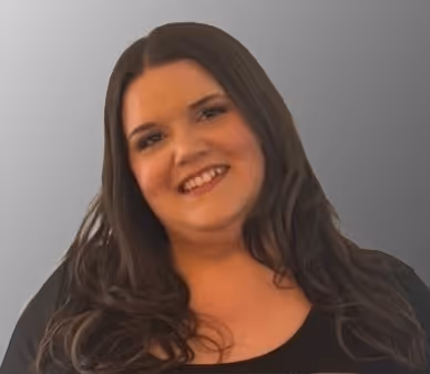 Smiling woman with long dark hair wearing a black top against a gray background.