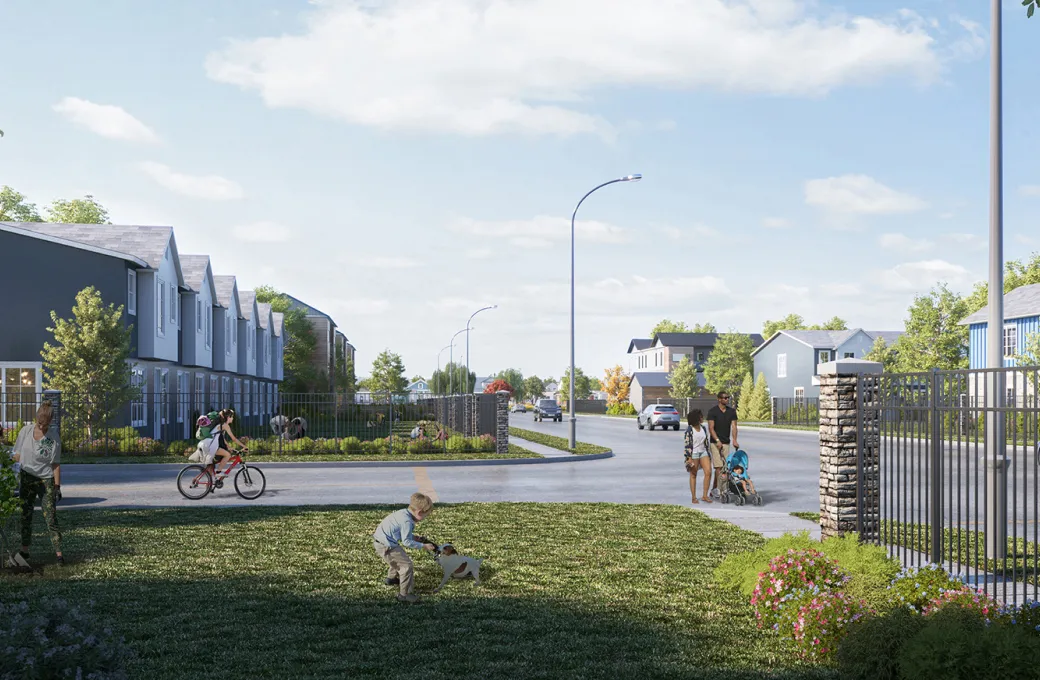 A man is sitting on the grass with a dog.