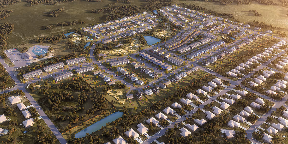Aerial view of a residential community masterplan with multiple houses, roads, green spaces, and ponds under soft sunset lighting.