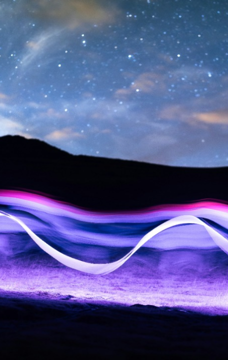 a-long-exposure-photo-of-a-wave-in-the-night-sky