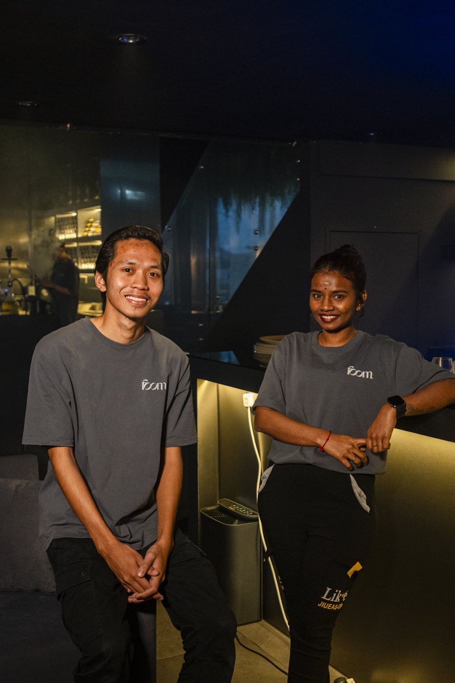 Two of the FOOM team smiling by the bar at FOOM, Johor Bahru