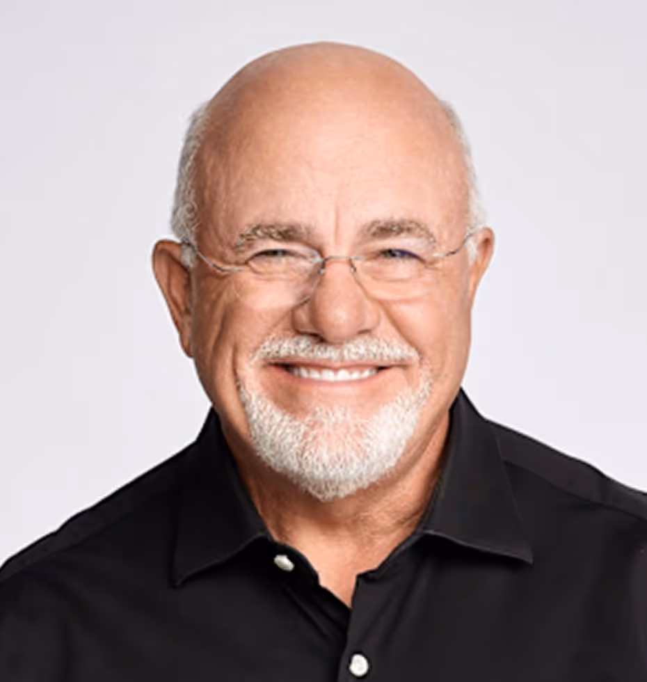 Smiling bald man with white beard and eyeglasses wearing a black button-up shirt.