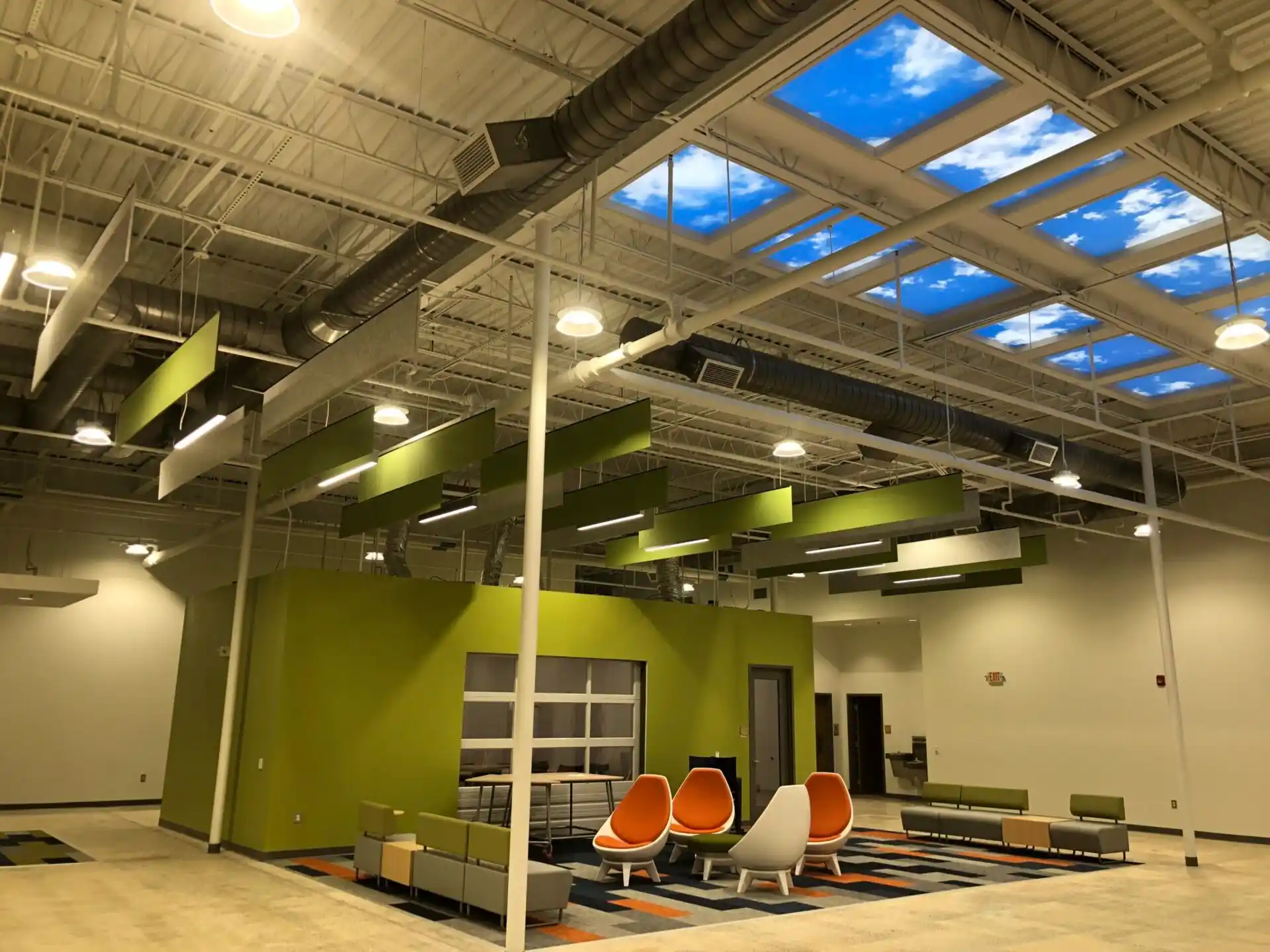 Modern office with exposed HVAC ductwork.