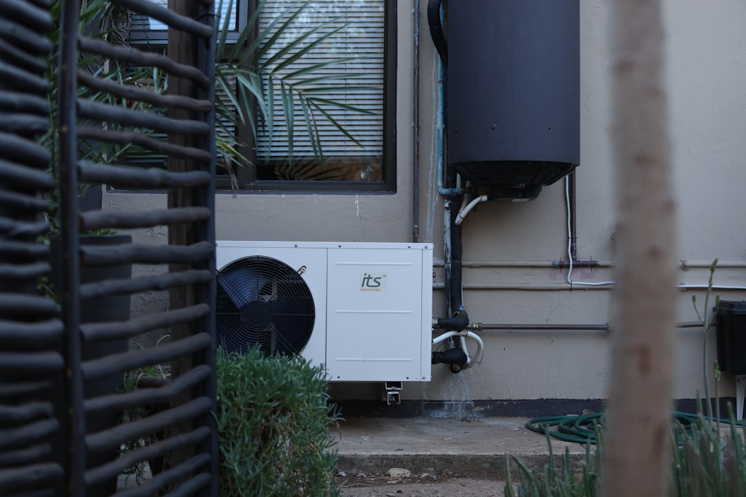 Outdoor heat pump cleared of leaves and debris after a storm Outdoor heat pump cleared of leaves and debris after a storm