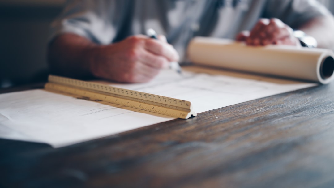 HVAC technician reviewing blueprints with a homeowner - how to choose the right hvac for new construction HVAC technician reviewing blueprints with a homeowner - how to choose the right hvac for new construction