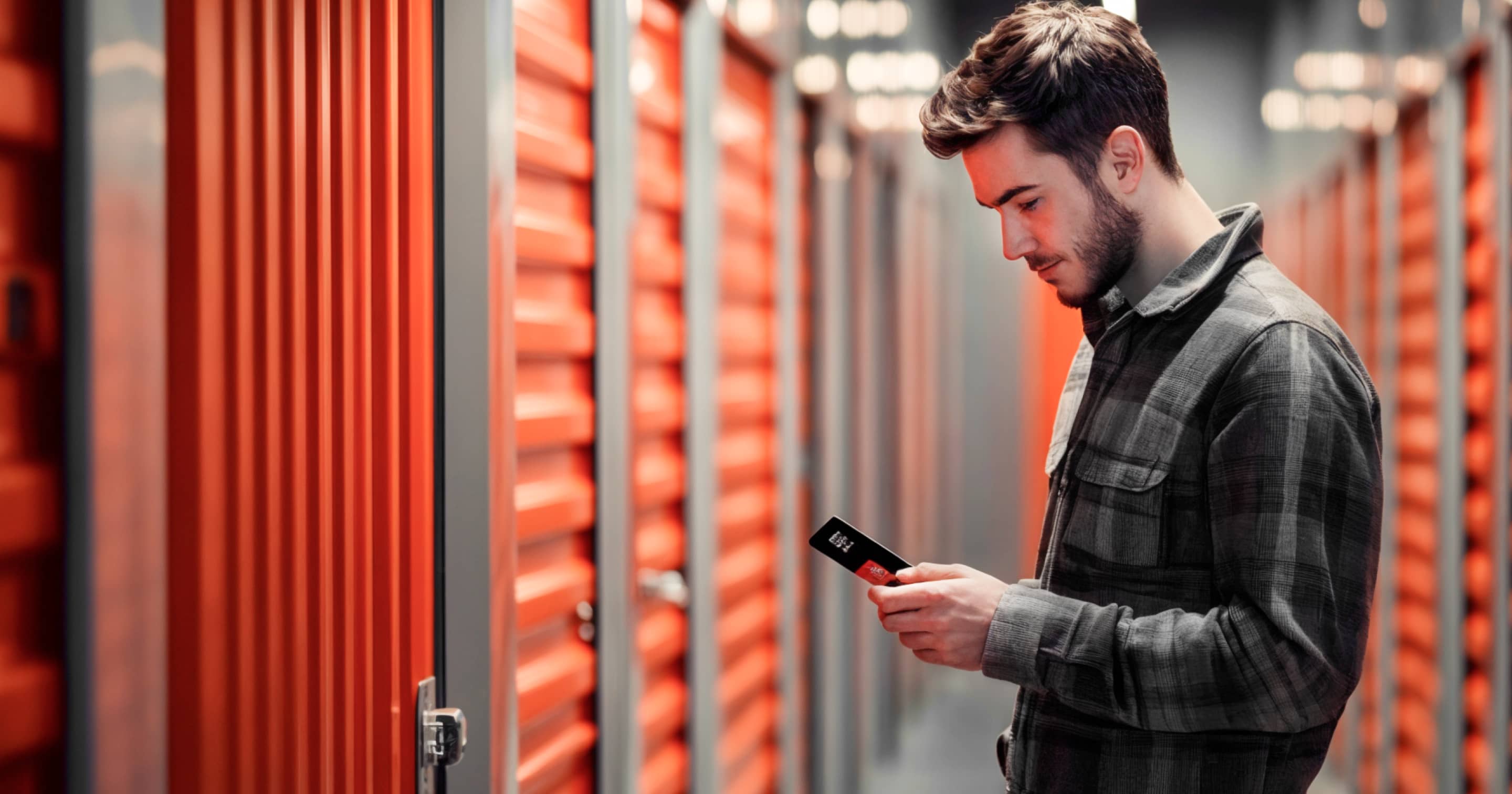 Self Storage Man Checking His Phone - SelfStorage X Webflow Template