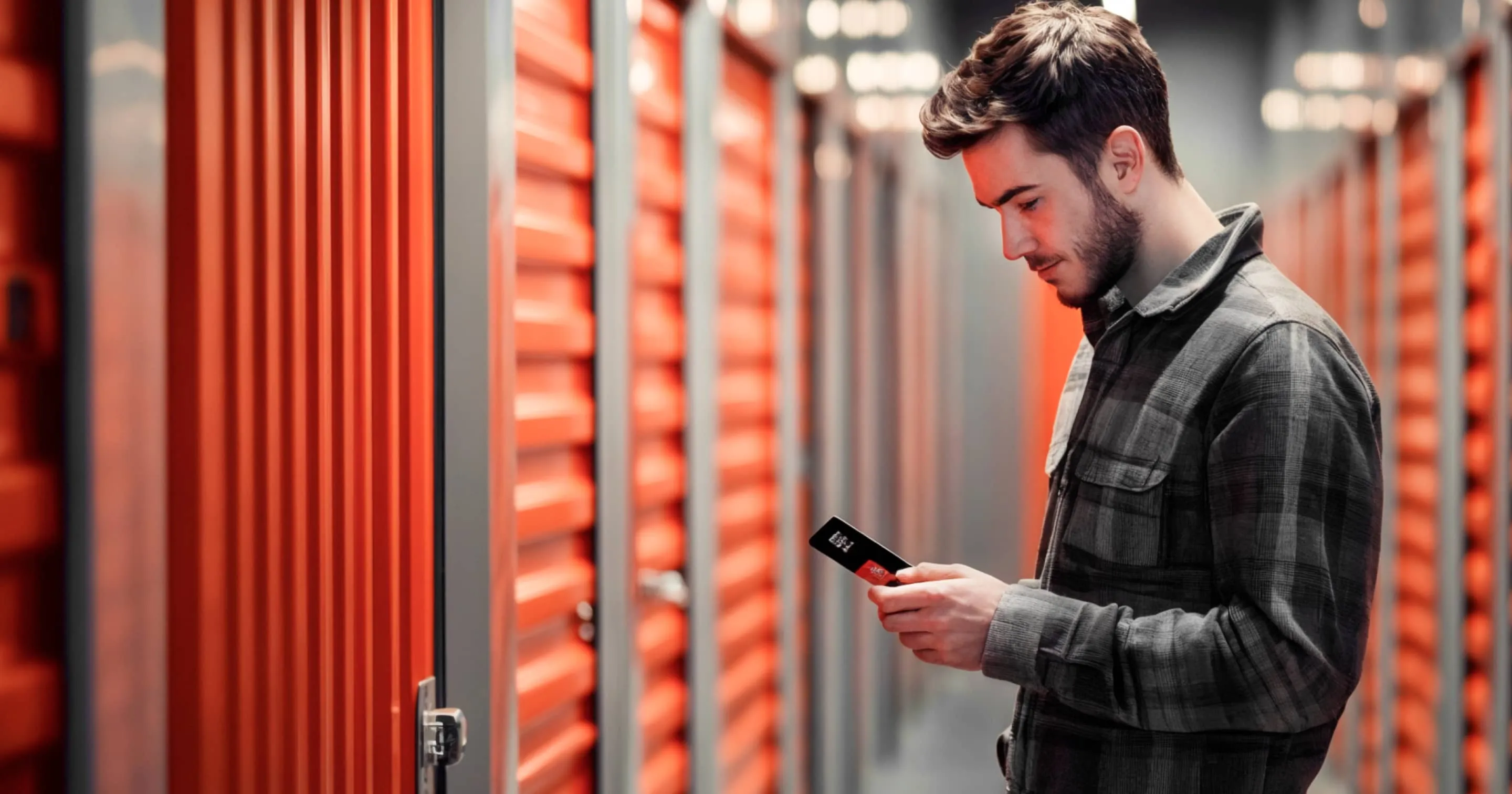 Self Storage Man Checking His Phone - SelfStorage X Webflow Template