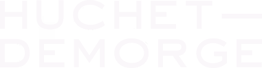 Logo de Huchet-Demorge en texte blanc sur fond transparent.