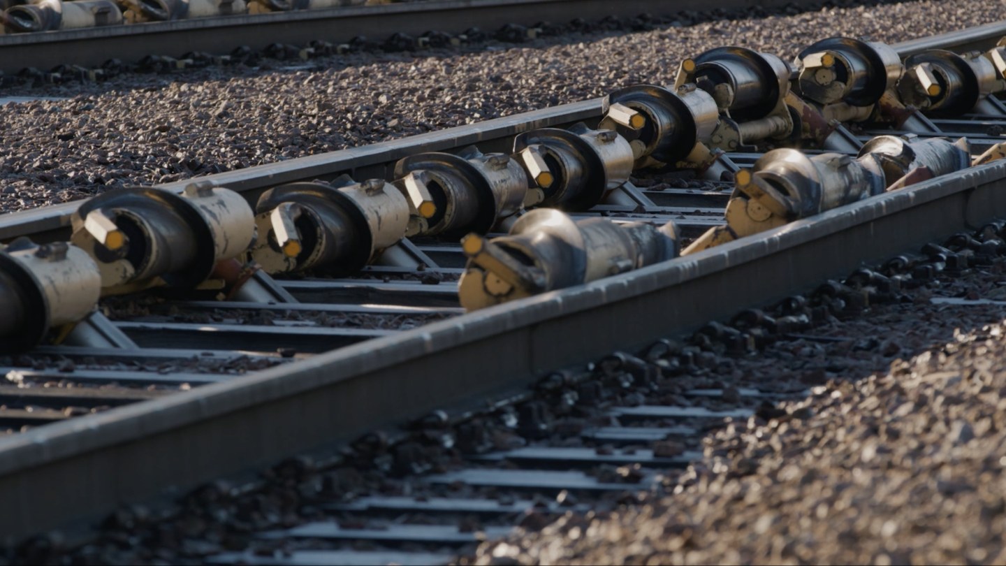 Close-up of rows of DECEL retarders along the rail at Tampere marshalling yard