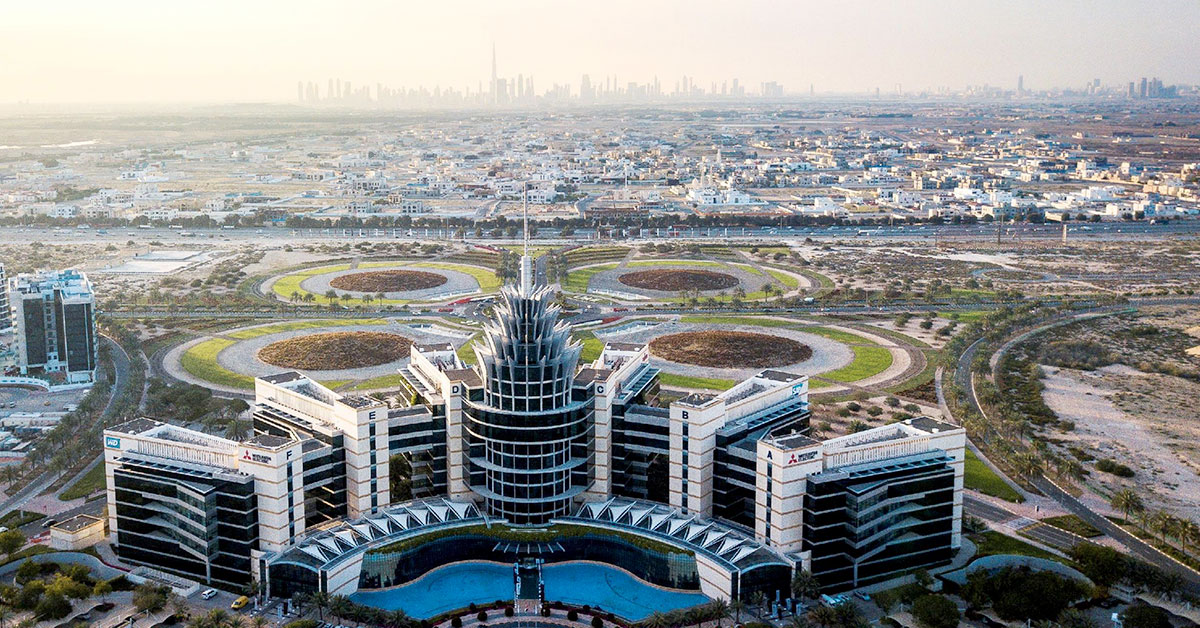 Aerial view of Dubai Silicon Oasis headquarters, landscaped roads and surrounding urban district in Dubai