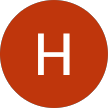 Biała litera H na pomarańczowym okrągłym tle.