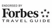Forbes Travel Guide endorsement logo with three stars.