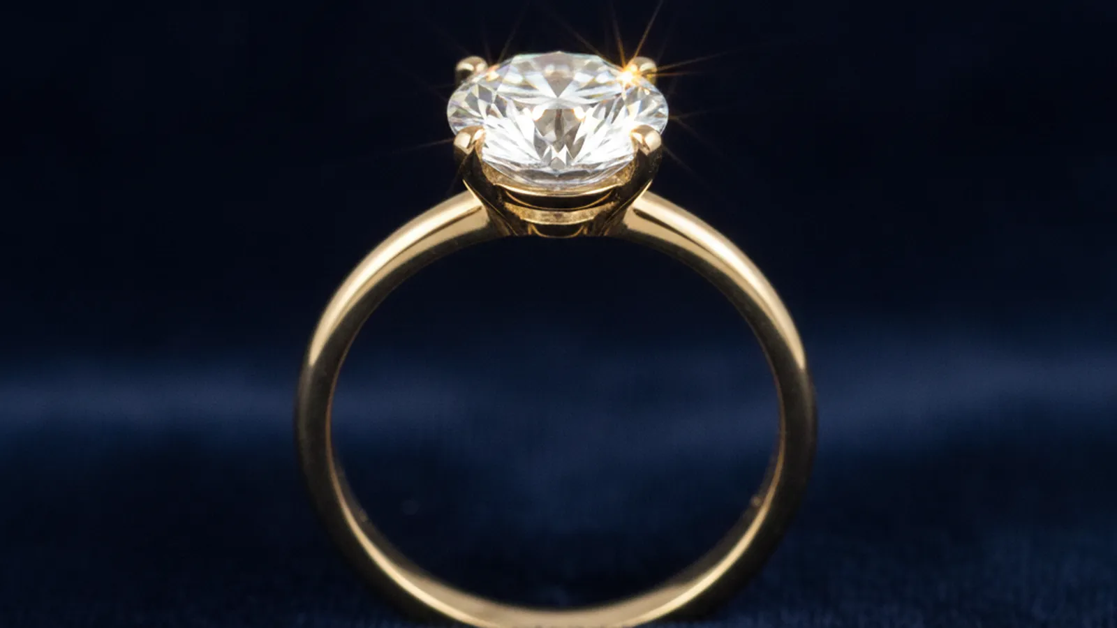 Diamond ring on a dark display surface