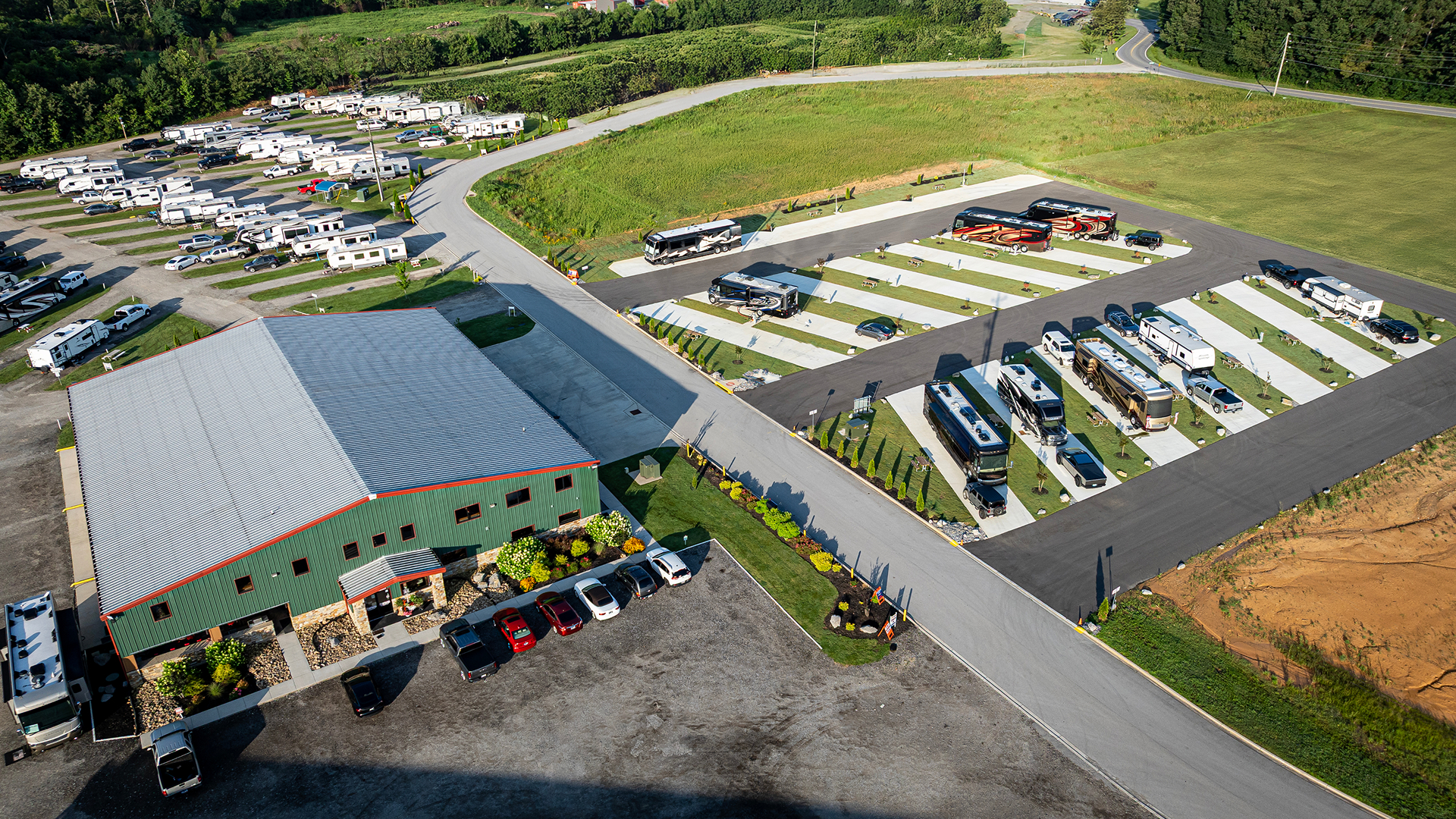 Aerial view of Hawkins Pointe RV Park with check-in building, executive sites to the right and extended stay sites.