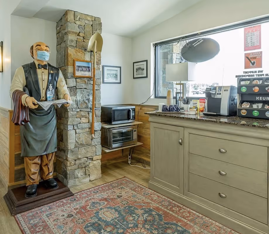 Coffee station and guest refreshments area at the Hawkins Pointe check-in office.