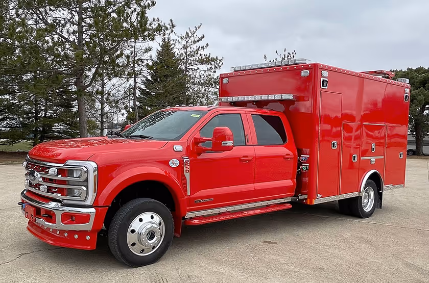  RV technician entering a motorhome with toolbox.