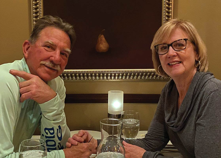  RV technician entering a motorhome with toolbox.