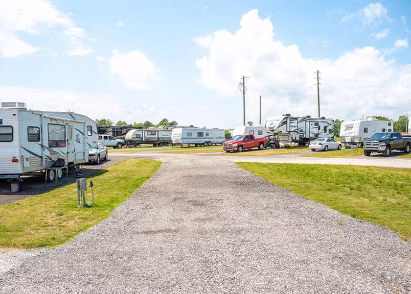  RV technician entering a motorhome with toolbox.