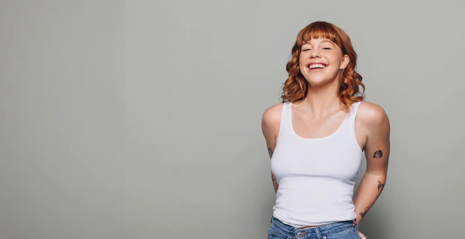 a woman smiling with red hair