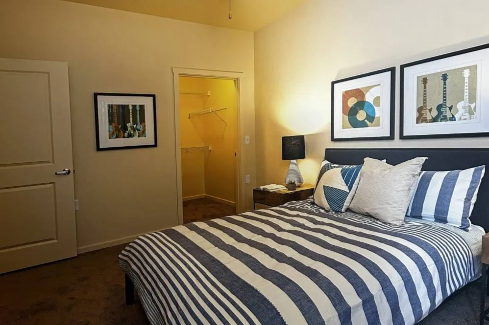 Bedroom furnished with bed and wall art