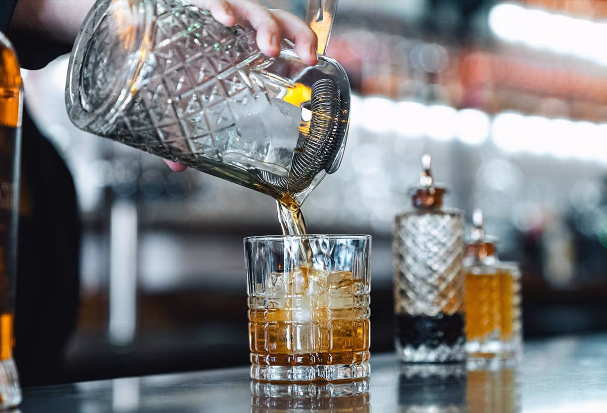 A mixed drink being poured into a glass at Junction 35 Spirits in Pigeon Forge, Tennessee.