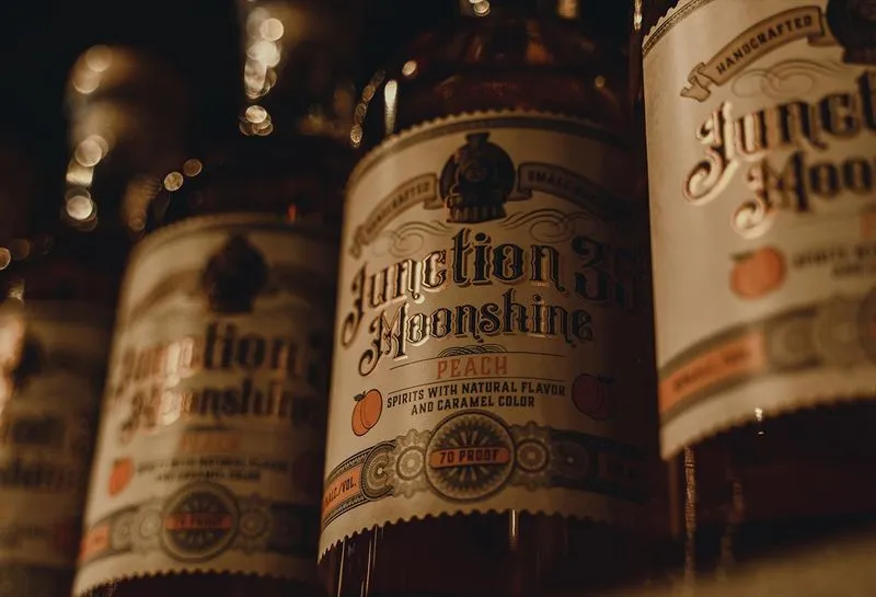 Junction 35 Moonshine bottles on a retail shelf.