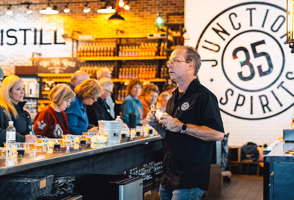 A bartender serving customers at Junction 35 Spirits in Pigeon Forge, Tennessee.
