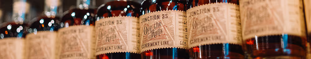 Junction 35 Off The Rails whiskey bottles on a shelf.