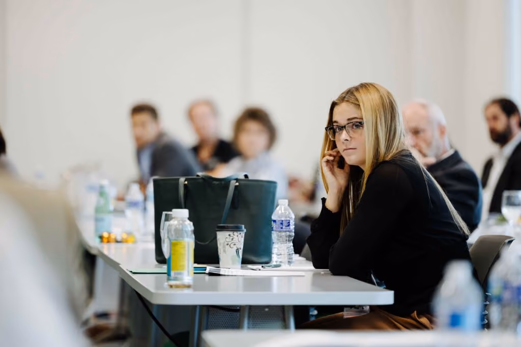 Woman listens to a presentation.
