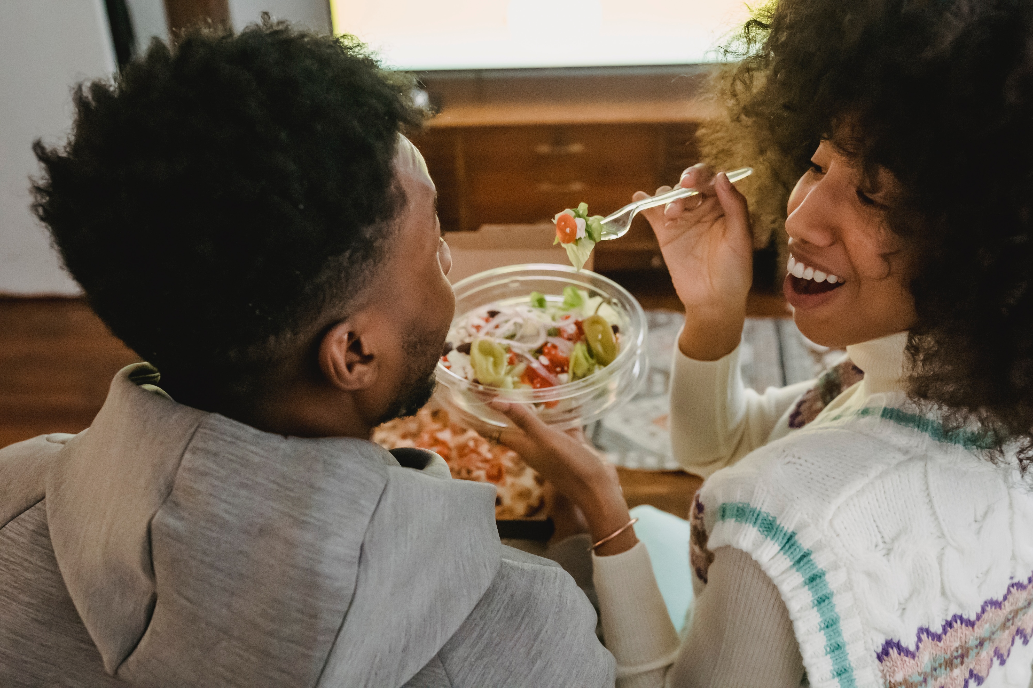 Couple feeding each other stock image
