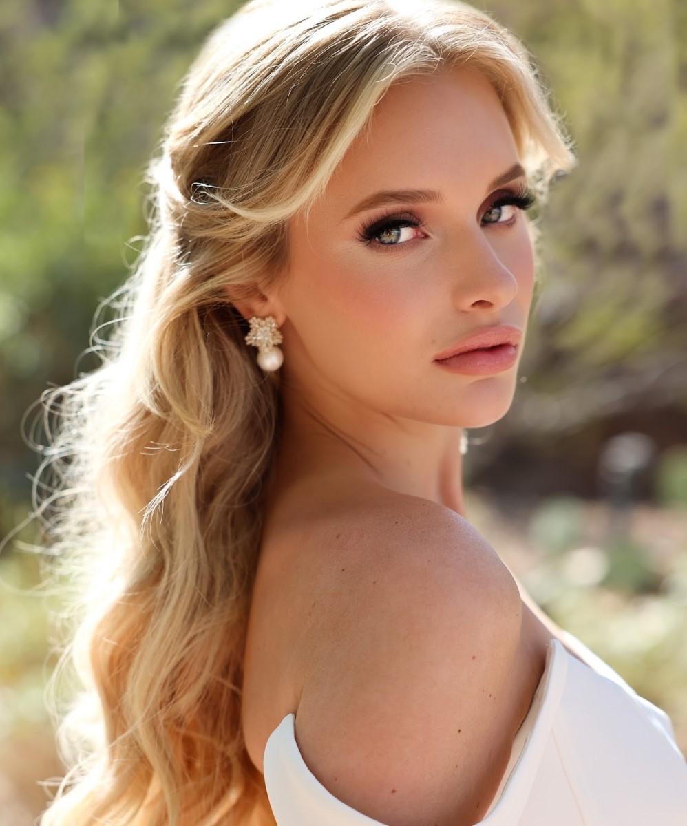 Professional makeup and stylist work showcasing elegant eye makeup, styled blonde hair, and jewelry