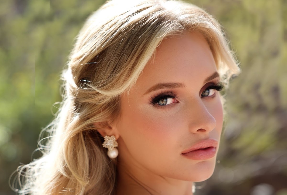 Professional makeup and stylist work showcasing elegant eye makeup, styled blonde hair, and jewelry