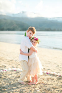 Siblings on the beach in Kauai.