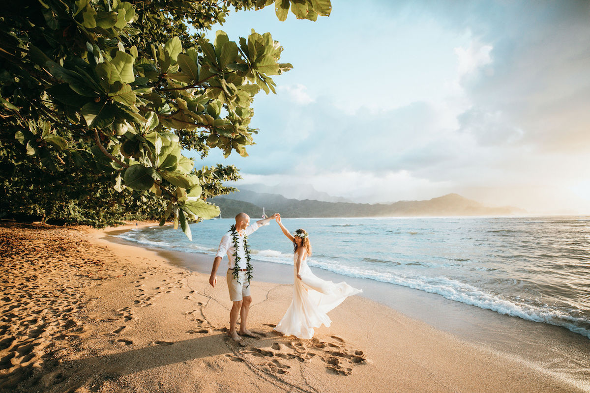 Couple eloping on a beach in Kauai.