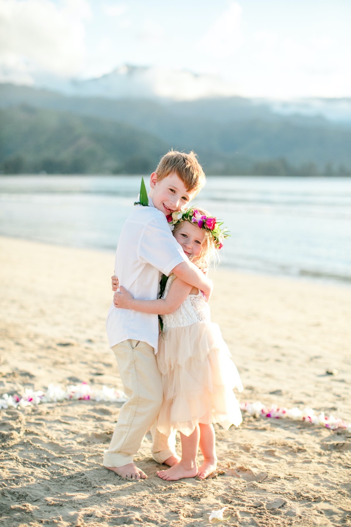 Two young children on the beach in Kauai.