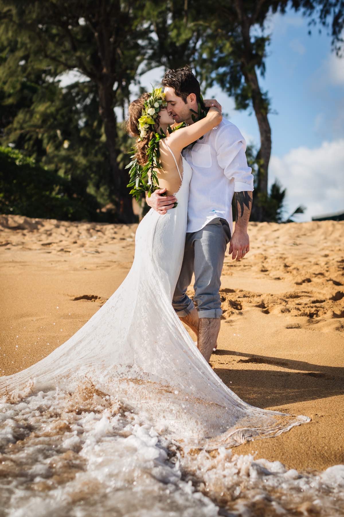 April and Chad on the beach in Hawaii.