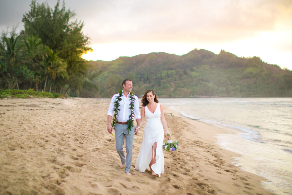 Couple eloping on the beach in Kauai.