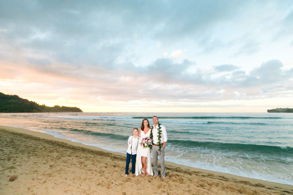 Couple eloping on the beach in Kauai.