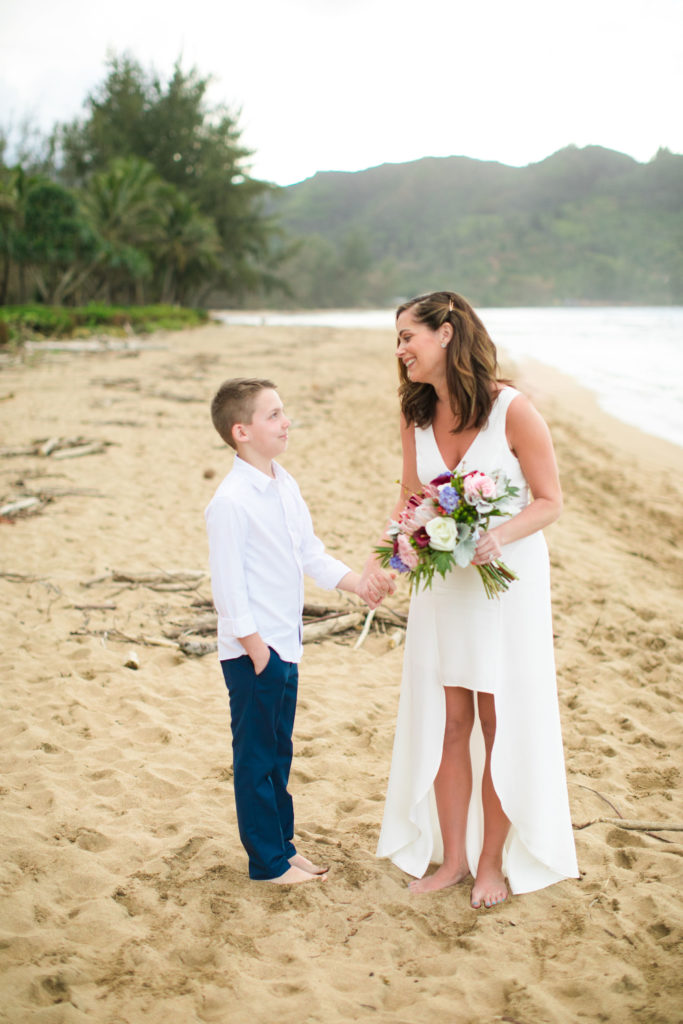 Mother and son on the beach during wedding.
