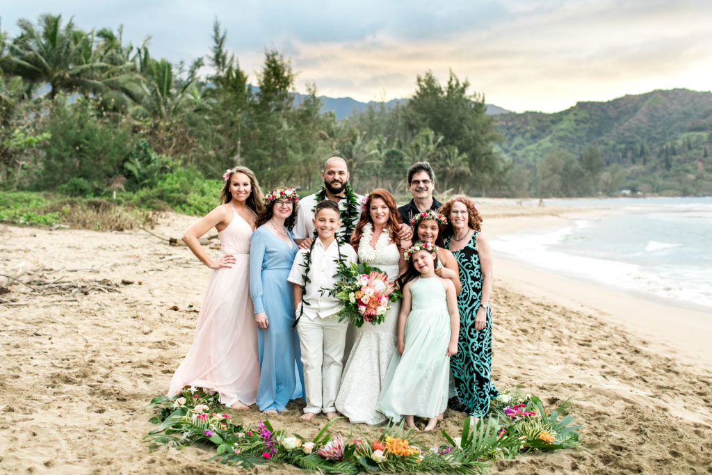 Family on the beach for a wedding in Hawaii.