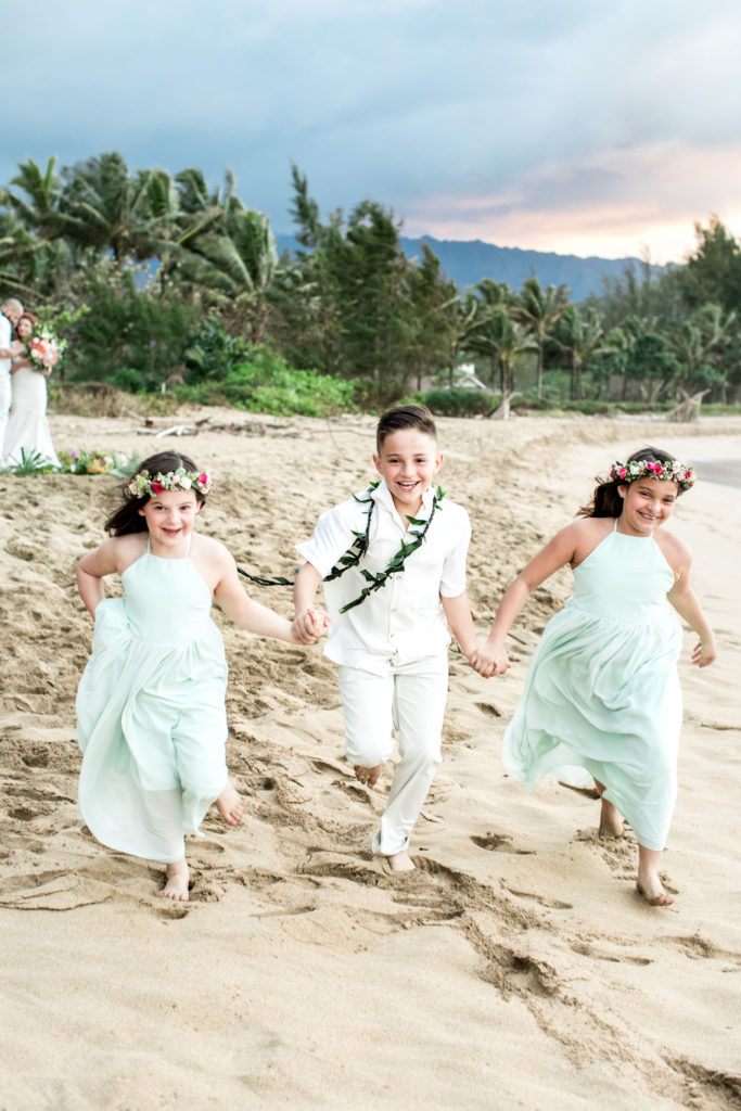 Children playing on the beach in Kauai.