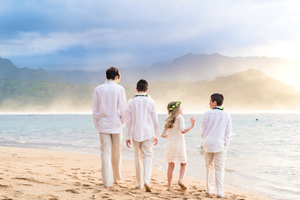 Children on a Kauai beach for a wedding.