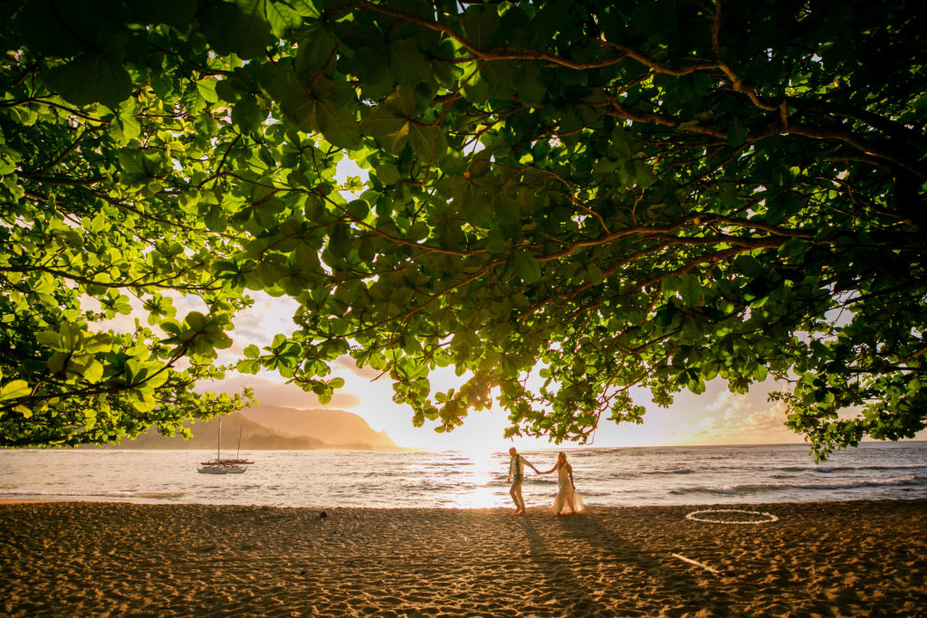 Bride and groom on the beach in Kauai.