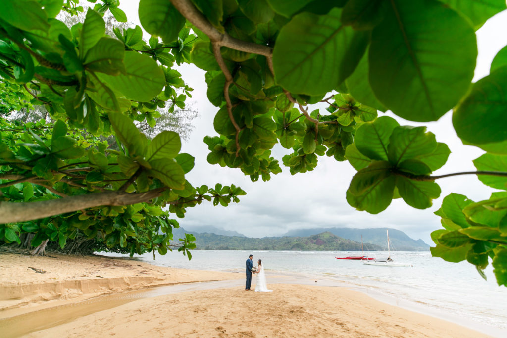 Couple getting married on the beach in Hawaii.