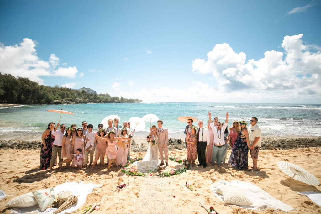 Family of the bride and groom on the beach for their wedding.