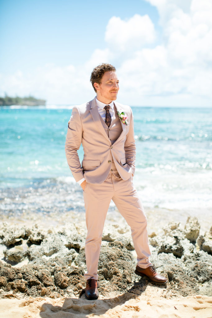 Groom on the beach in Hawaii.