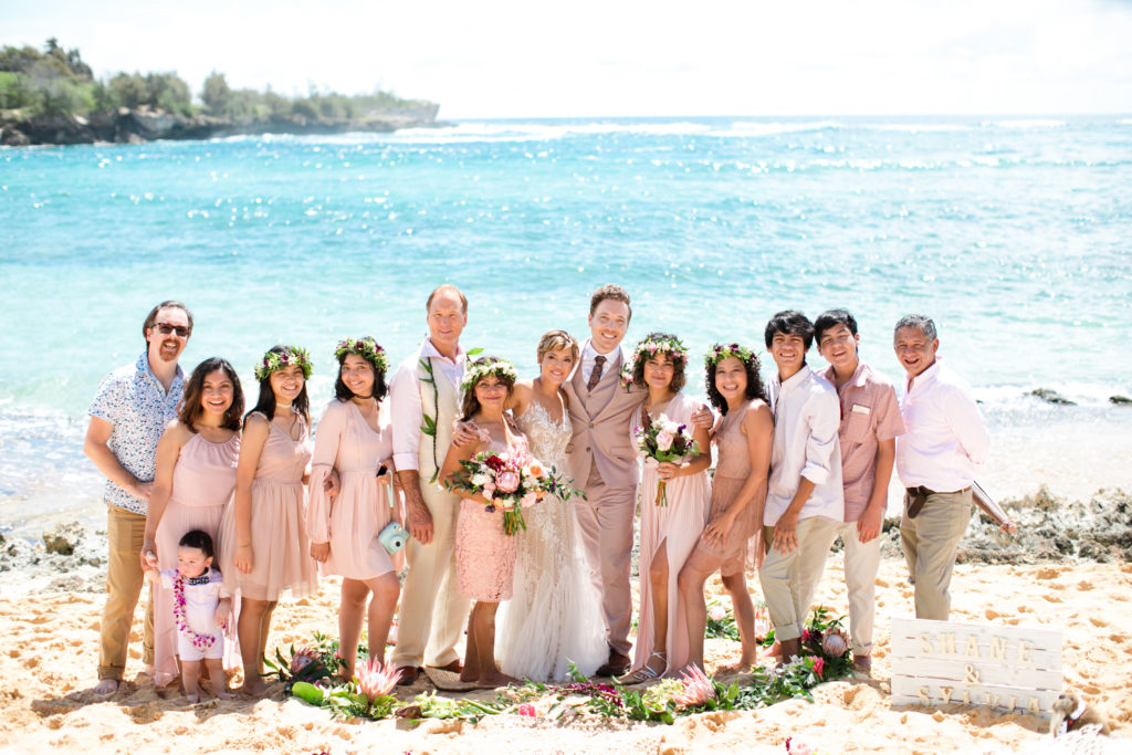 Family portrait on the beach in Kauai.